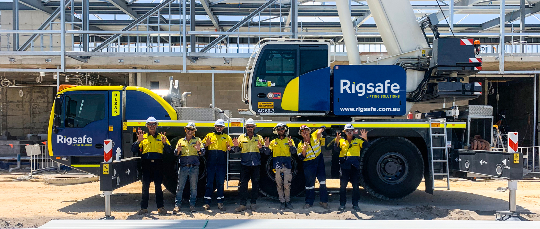 Rigsafe team stand in front of Rigsafe Crane